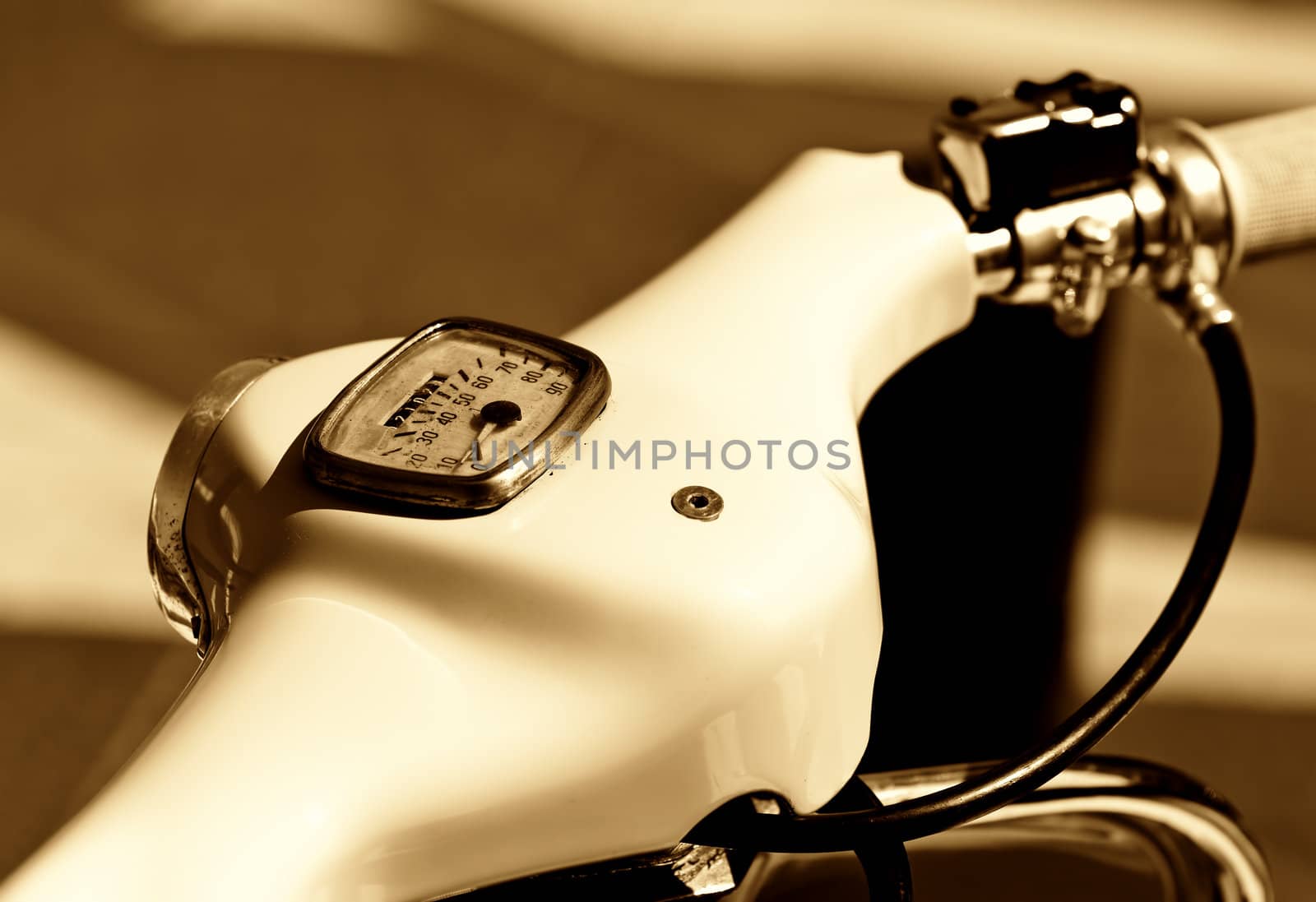an old motorcycle in sepia colors
