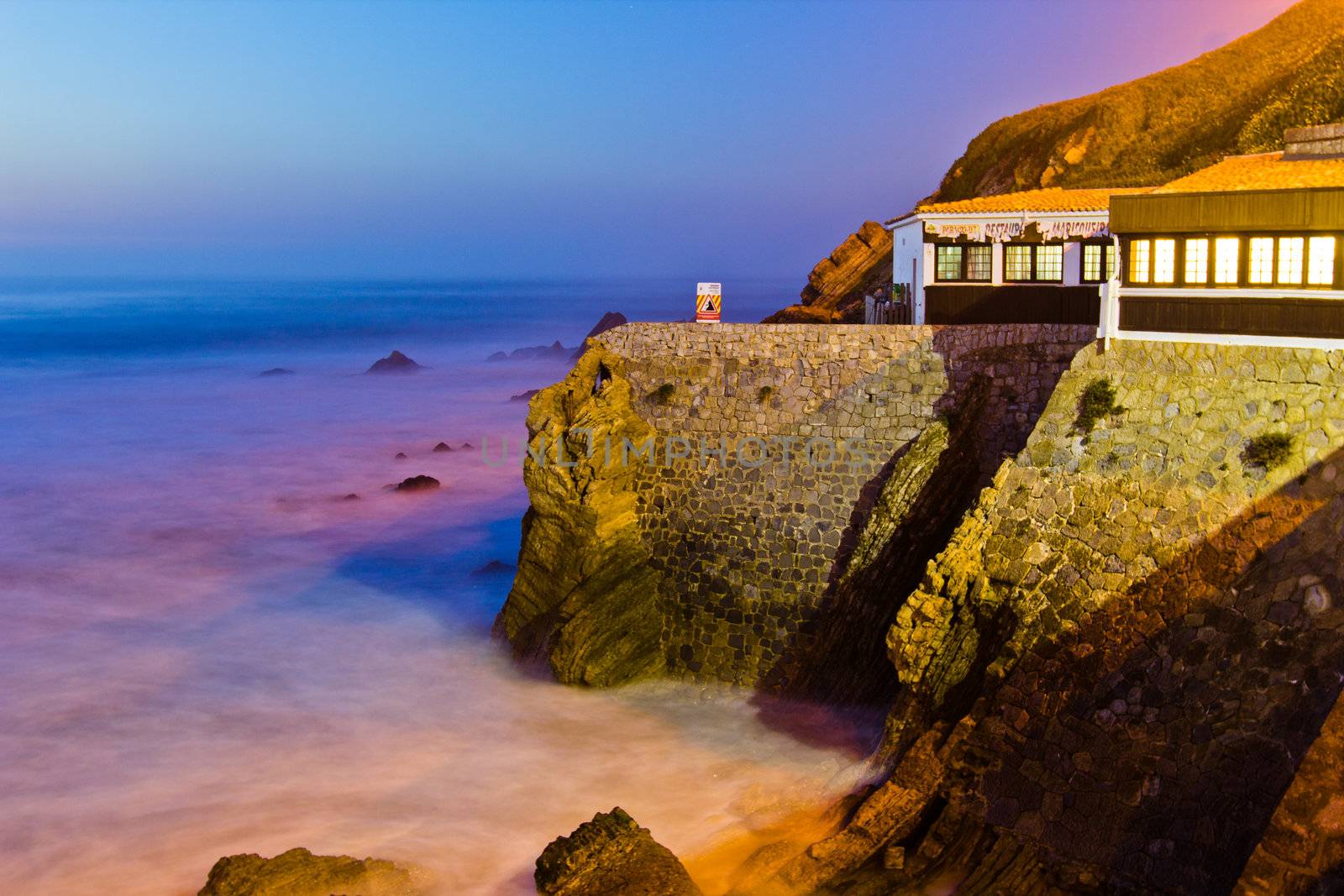 Restaurant on a cliff on sunset in São Pedro de Moel, Portugal