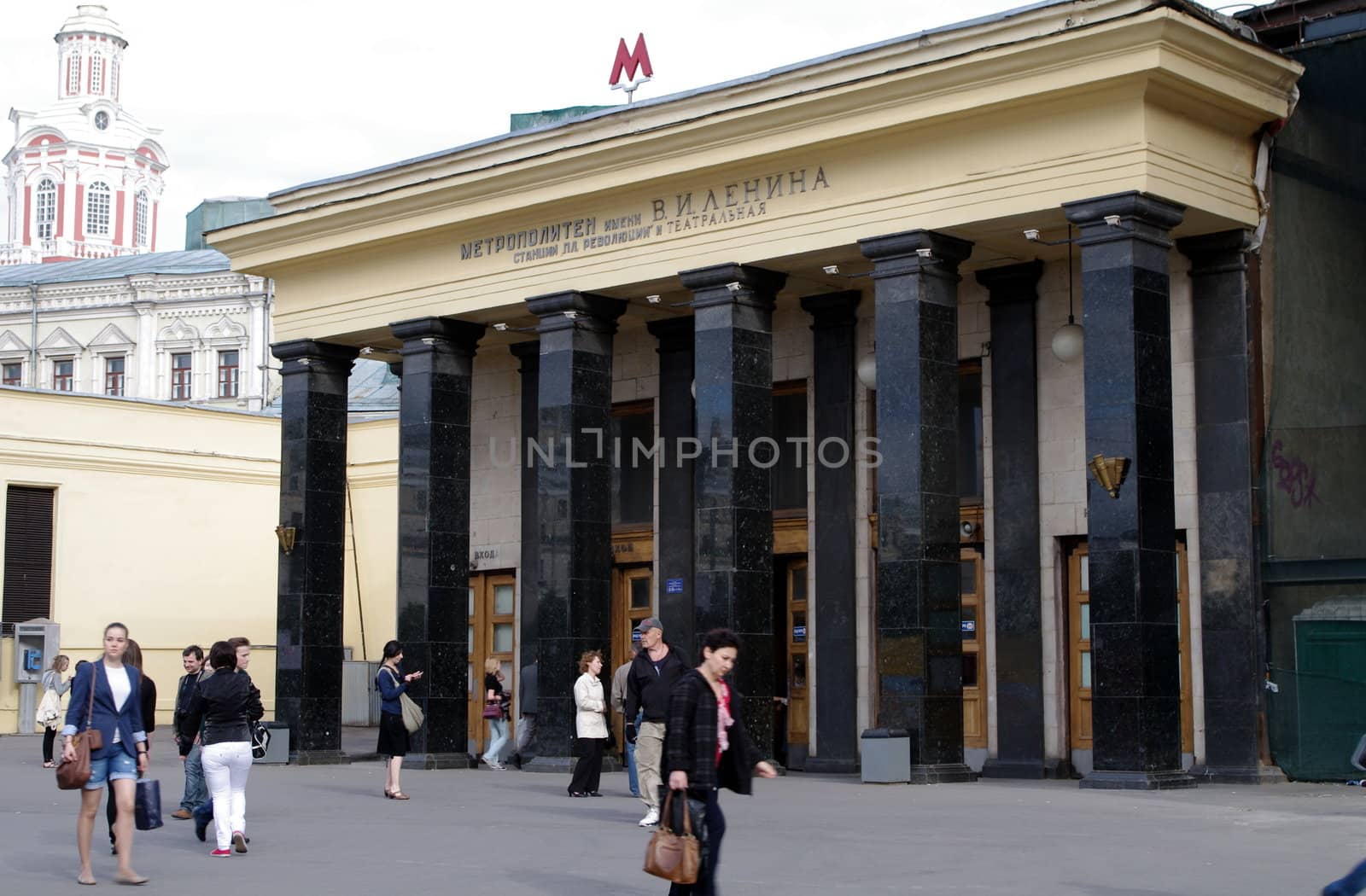 Moscow, Russia - June 14, 2010: Summer day. Peoples walk near the entrance of Teatral'naya metro station on June 14, 2010 in Moscow, Russia by Stoyanov