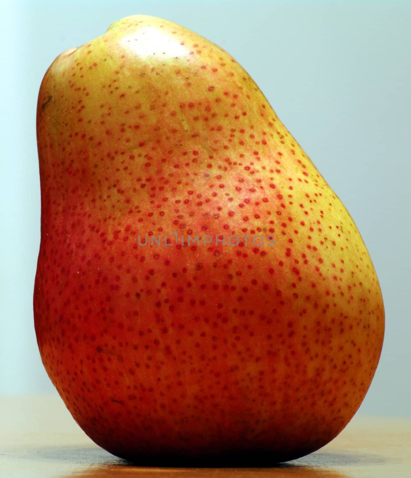 Fresh pear in light background by Stoyanov