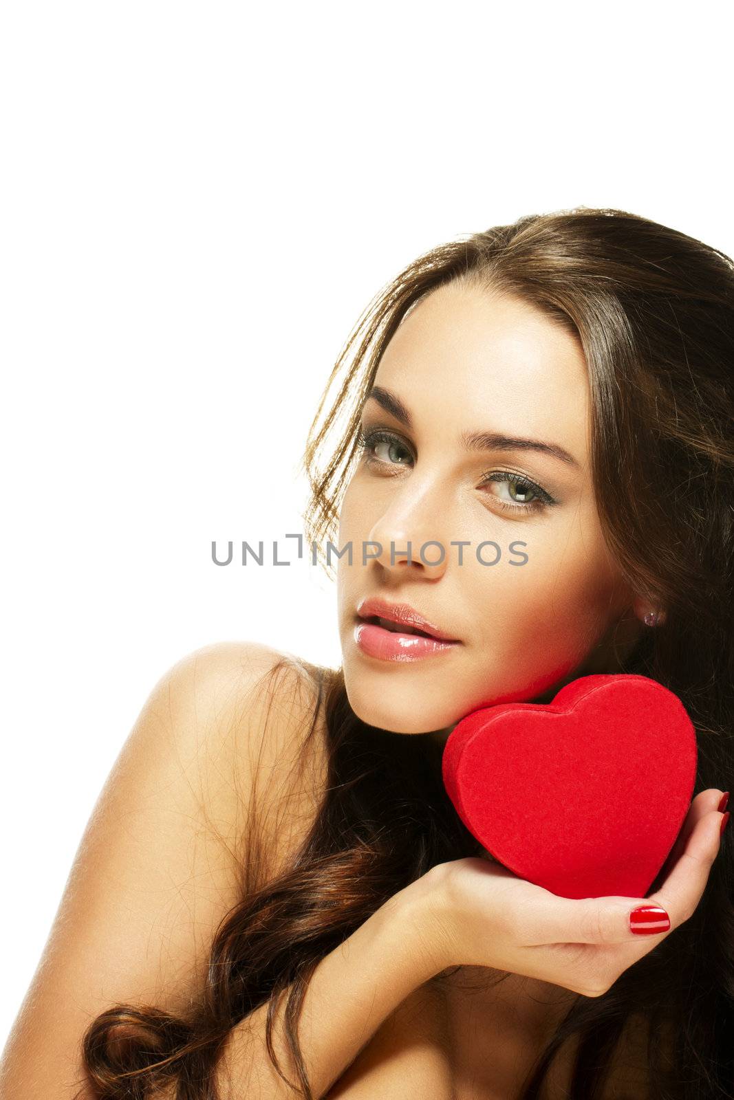 beautiful woman holding small red heart on white background