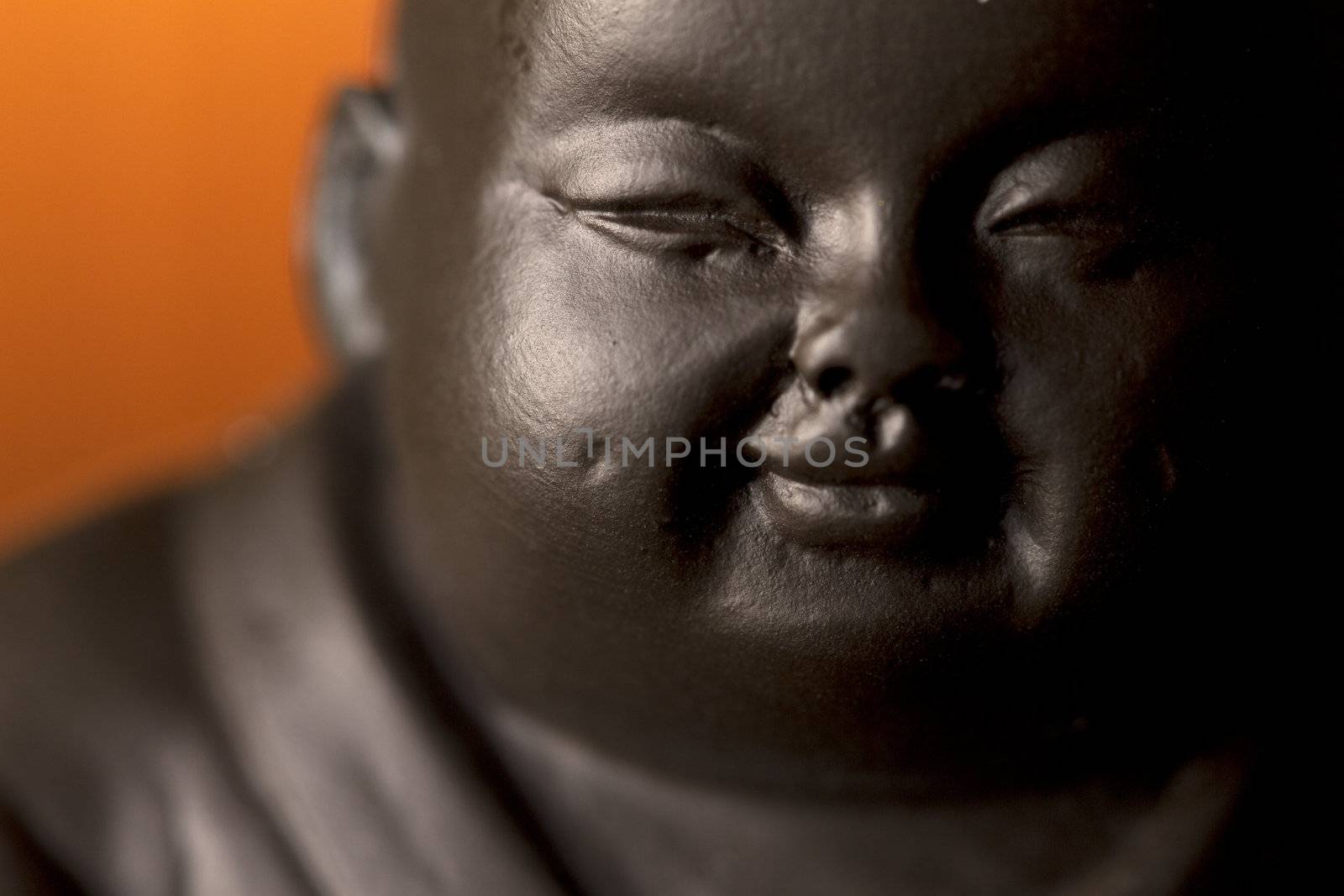 Close-up of face on a buddha figurine.