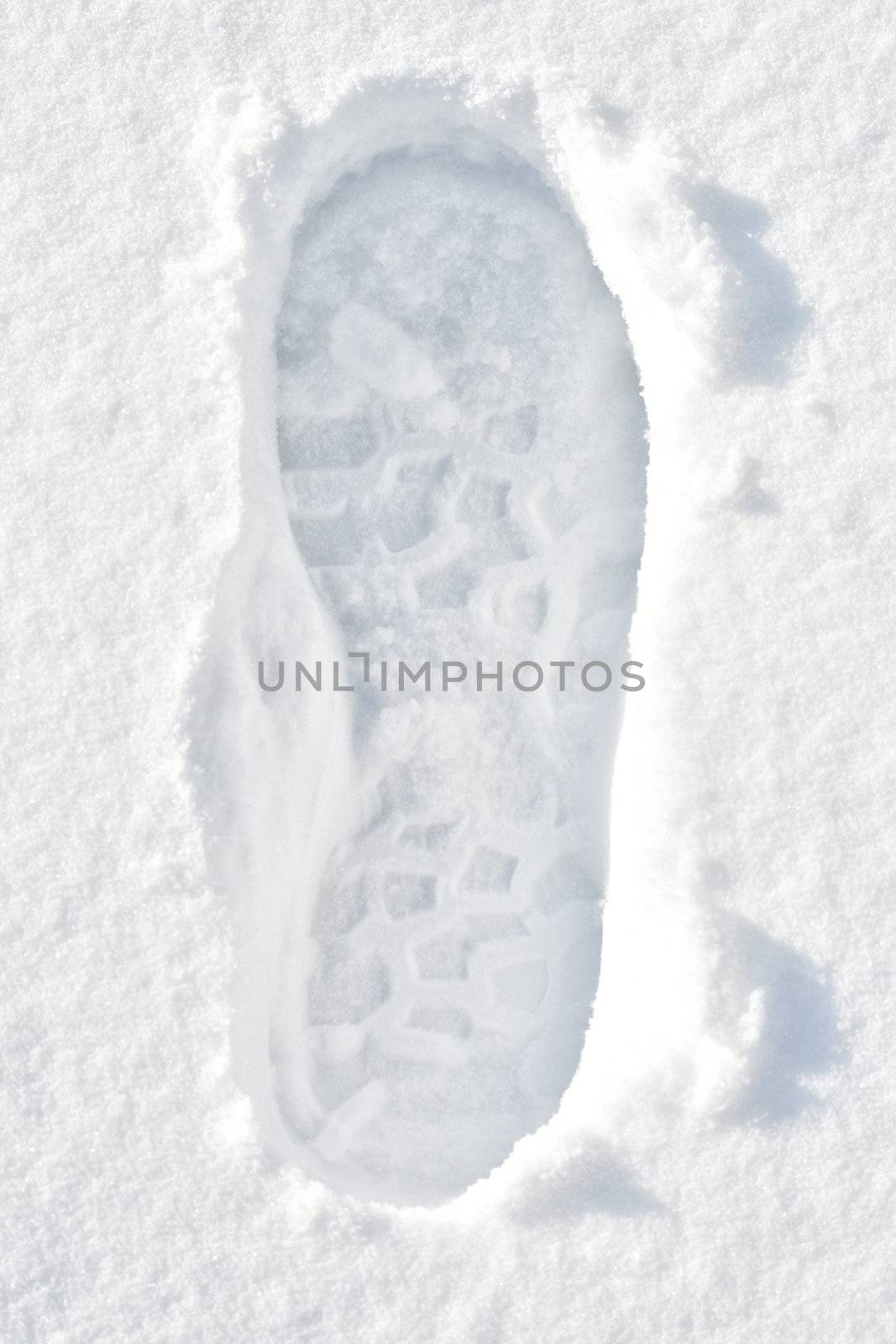 close-up footprint on white snow