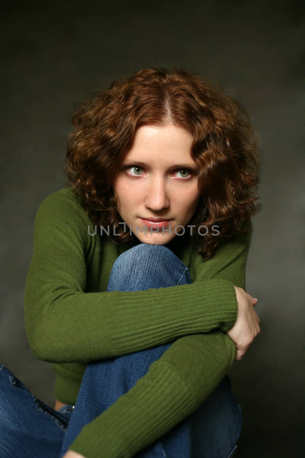 The young woman with green eyes in studio