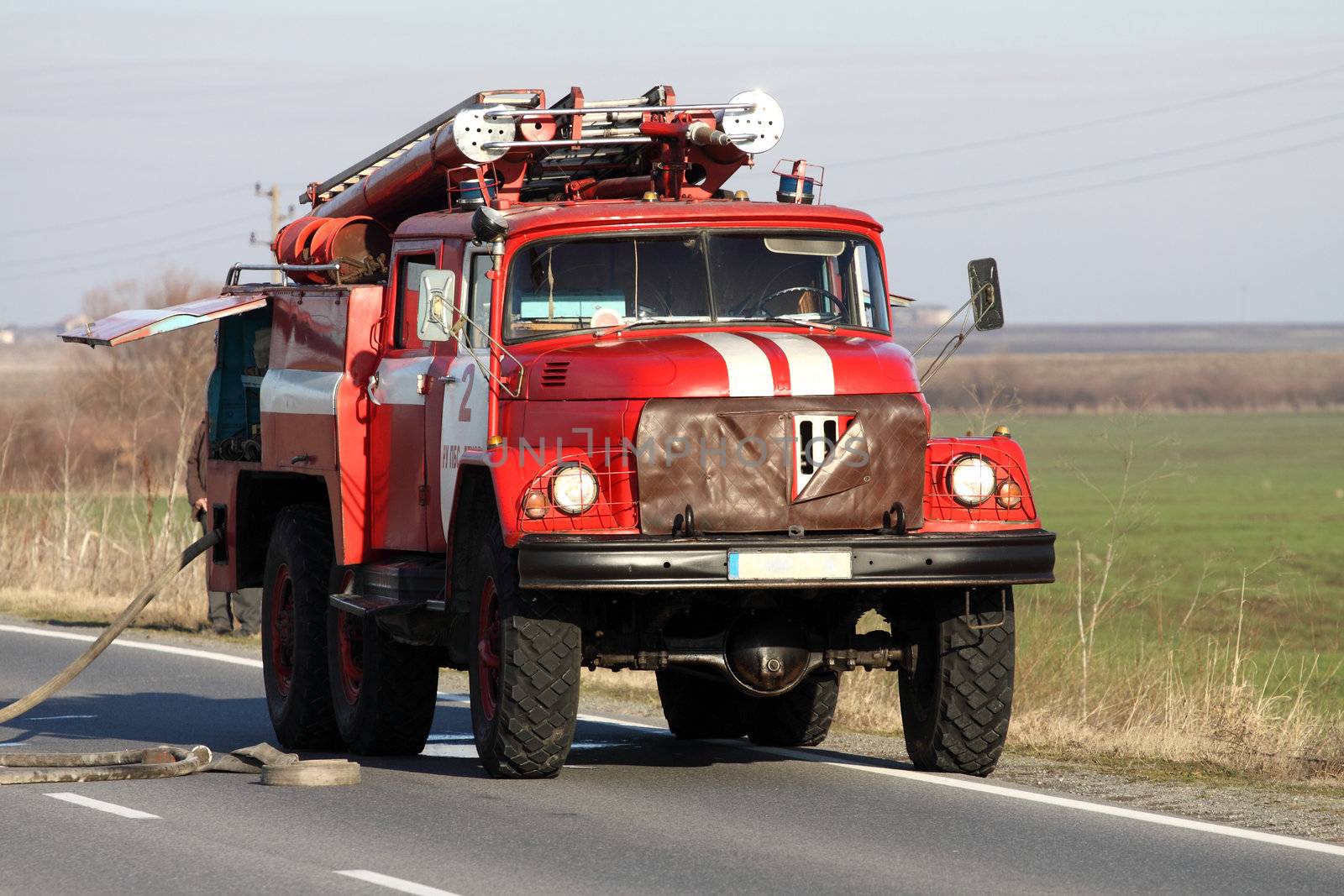 Red Fire Truck in action on the road