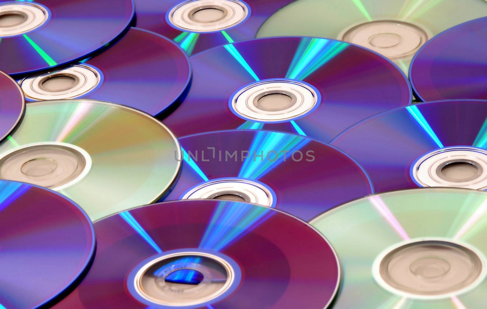 background full of CDs and DVDs