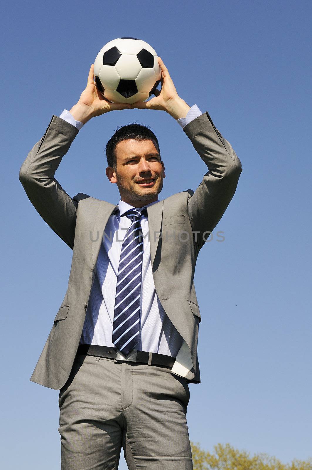 Business man coaching soccer