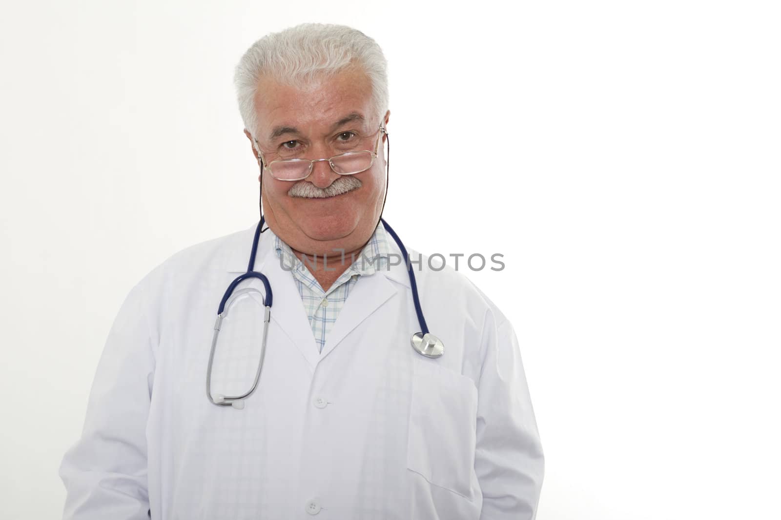 Experienced grey hair male doctor looking at the objective,