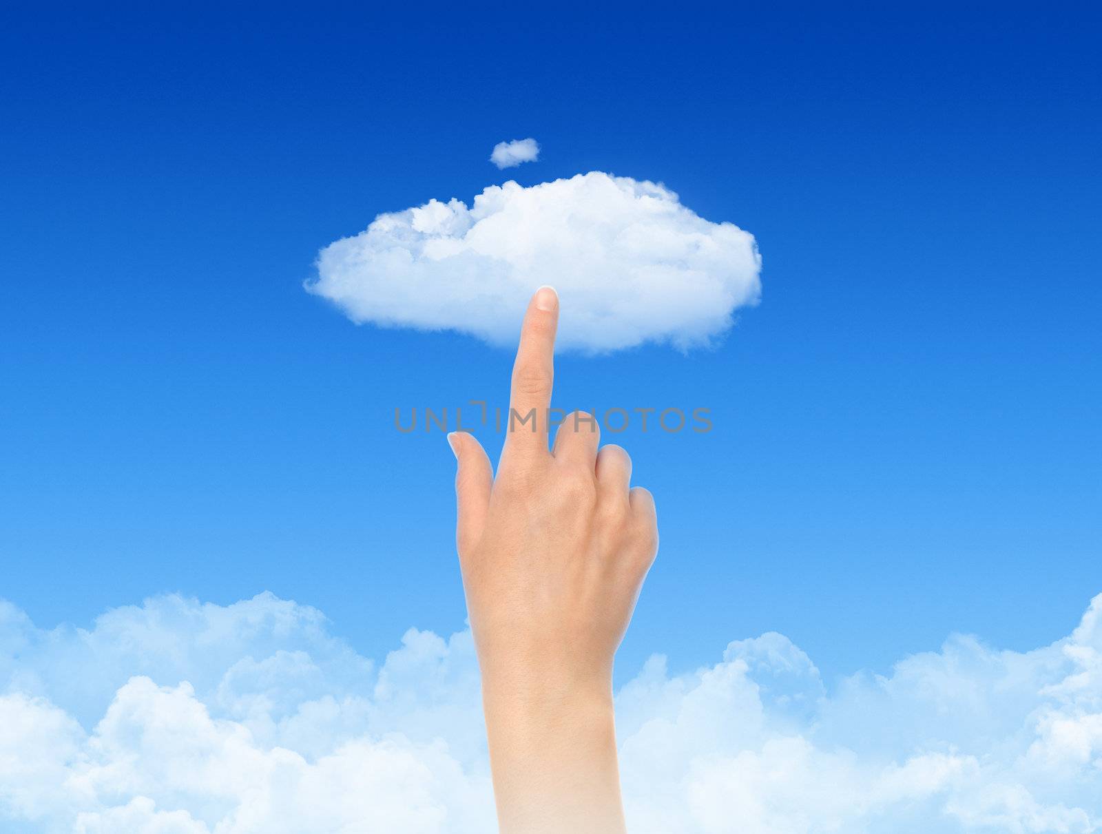 Woman hand touch the cloud against blue sky with clouds. Concept image on cloud computing and eco theme.