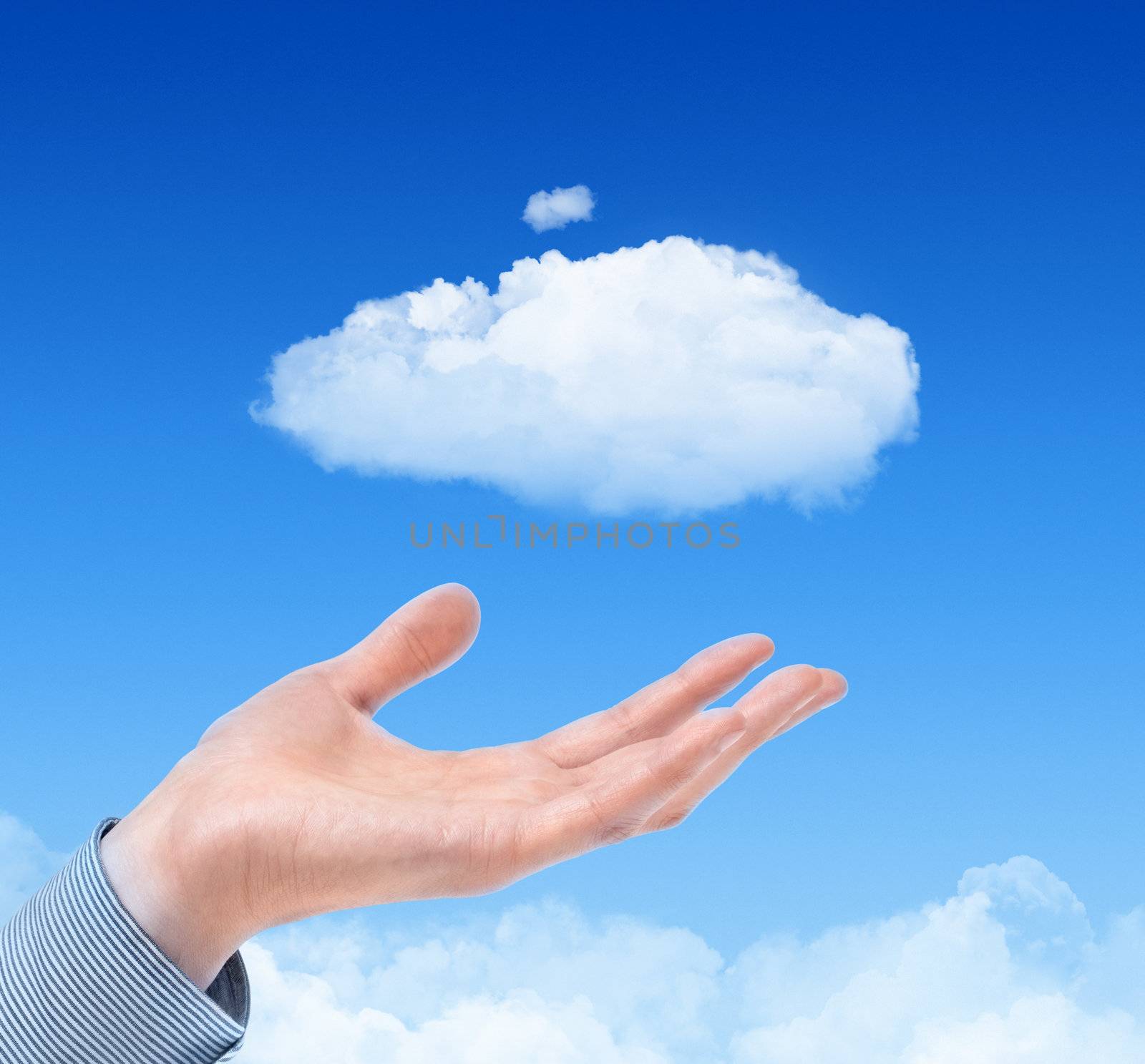 Man hand propose cloud against blue sky with clouds on background. Concept image on cloud computing and eco theme.