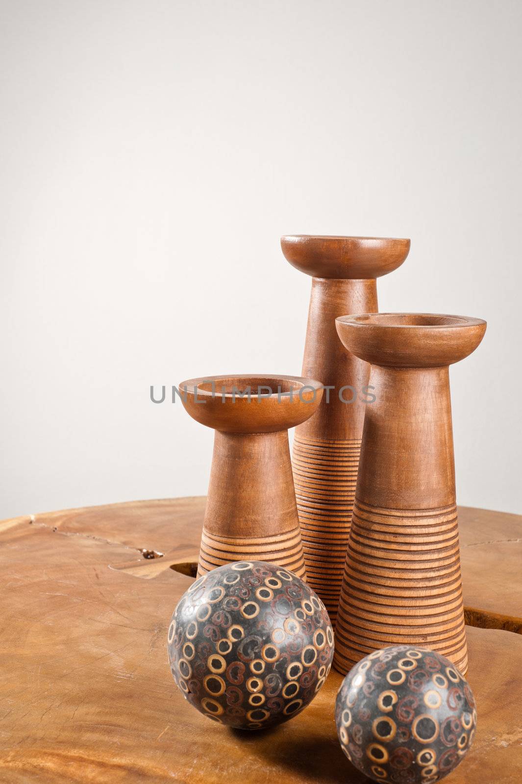 Candlesticks as interior decoration on wooden table