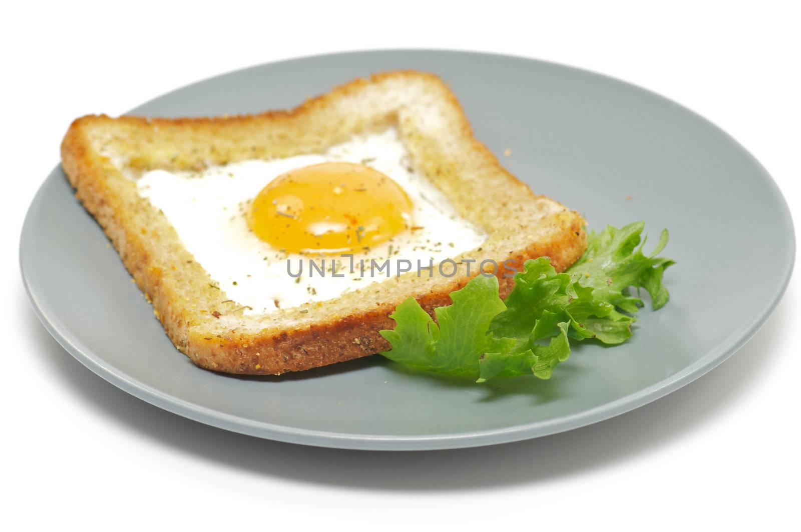 Fried eggs in French with salad leaves by zhekos