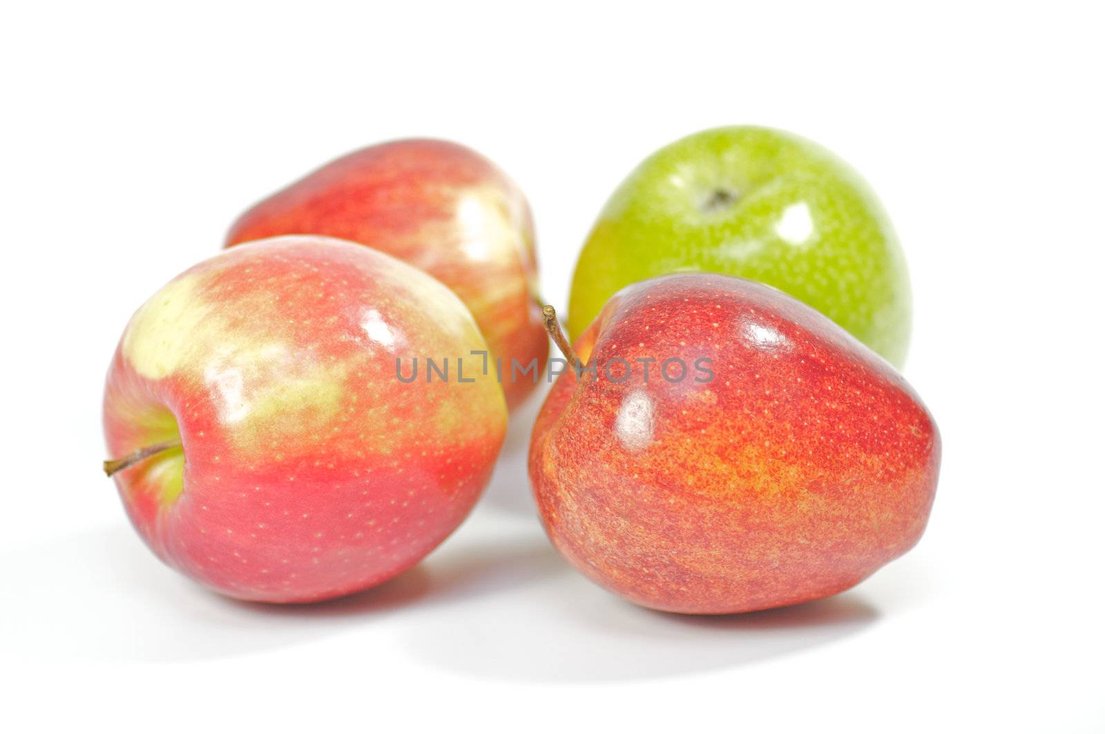 Four delicious apples on white background