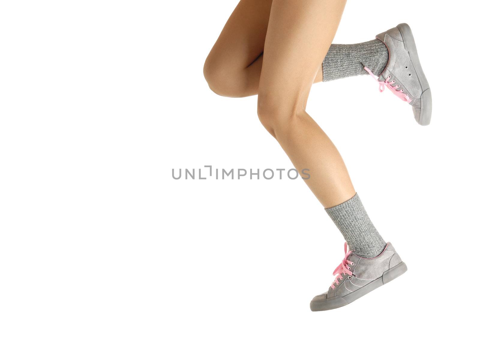 Sport photo of the jumping and running legs in shoes