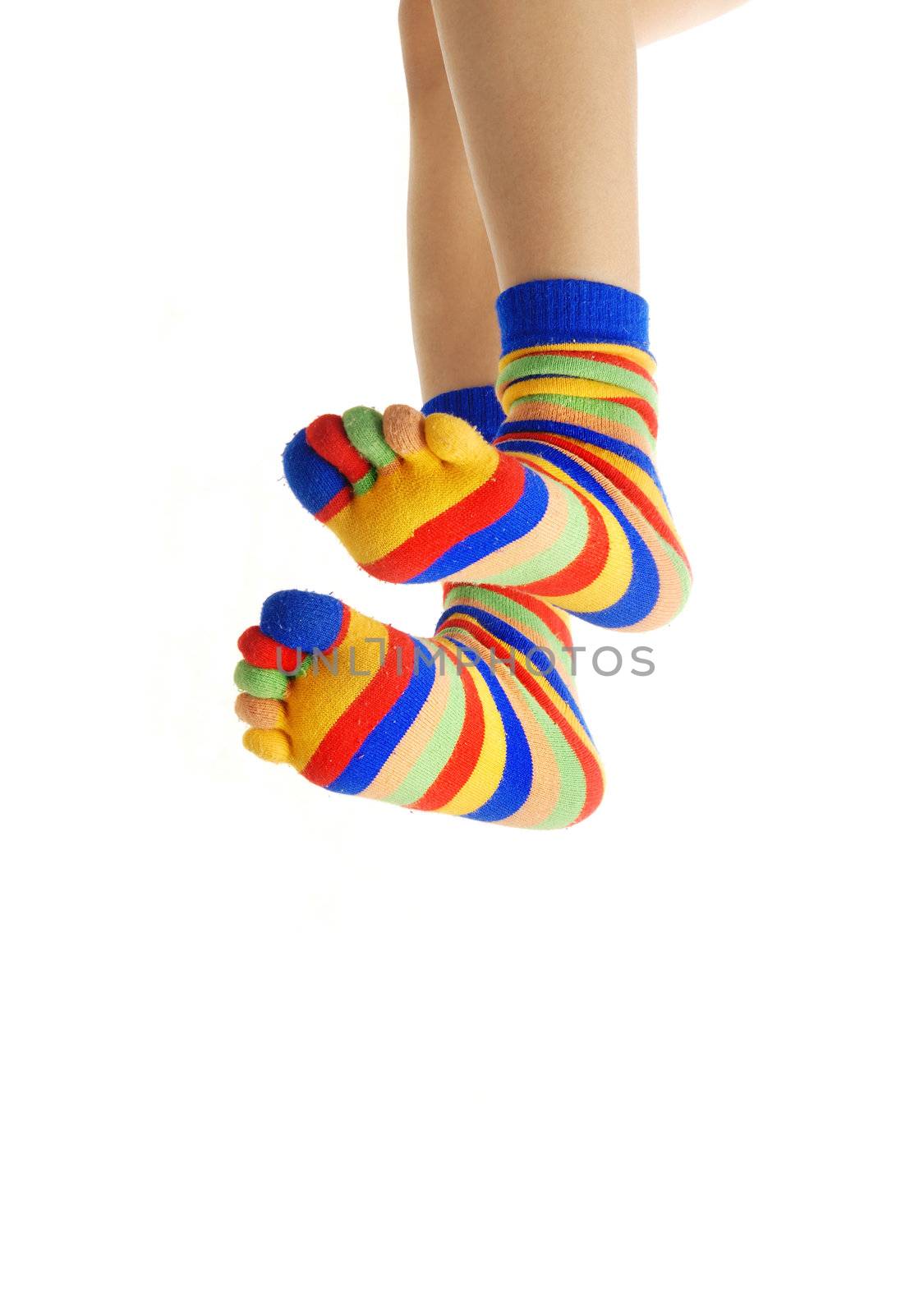 Close-up photo of jumpring human foots in zebrine socks