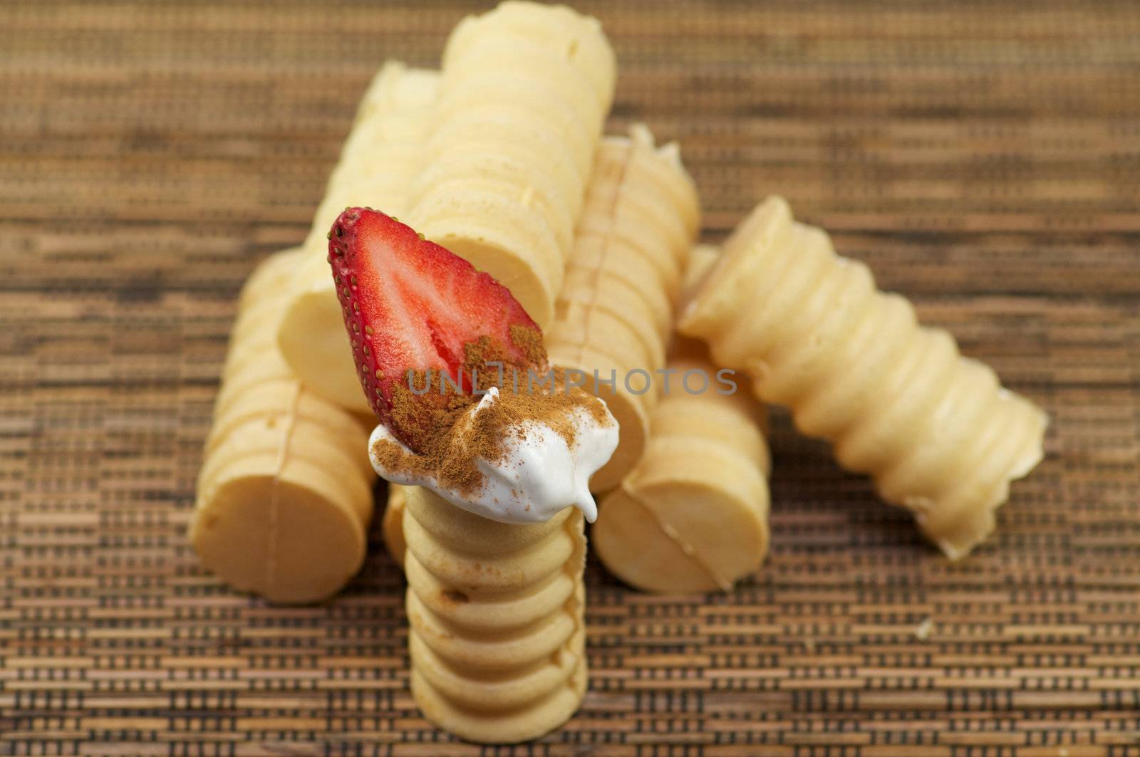 Tubules from shortcake dough with whipped cream and strawberry