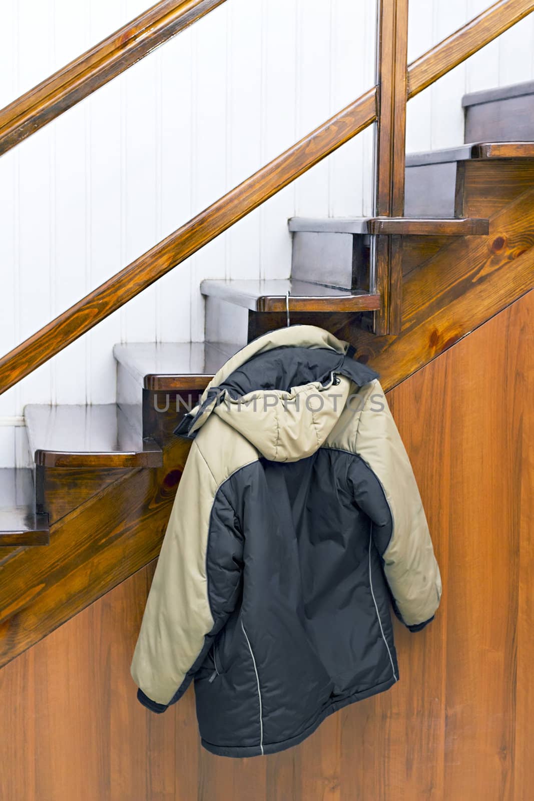jacket on a hanger hanging on the stairs