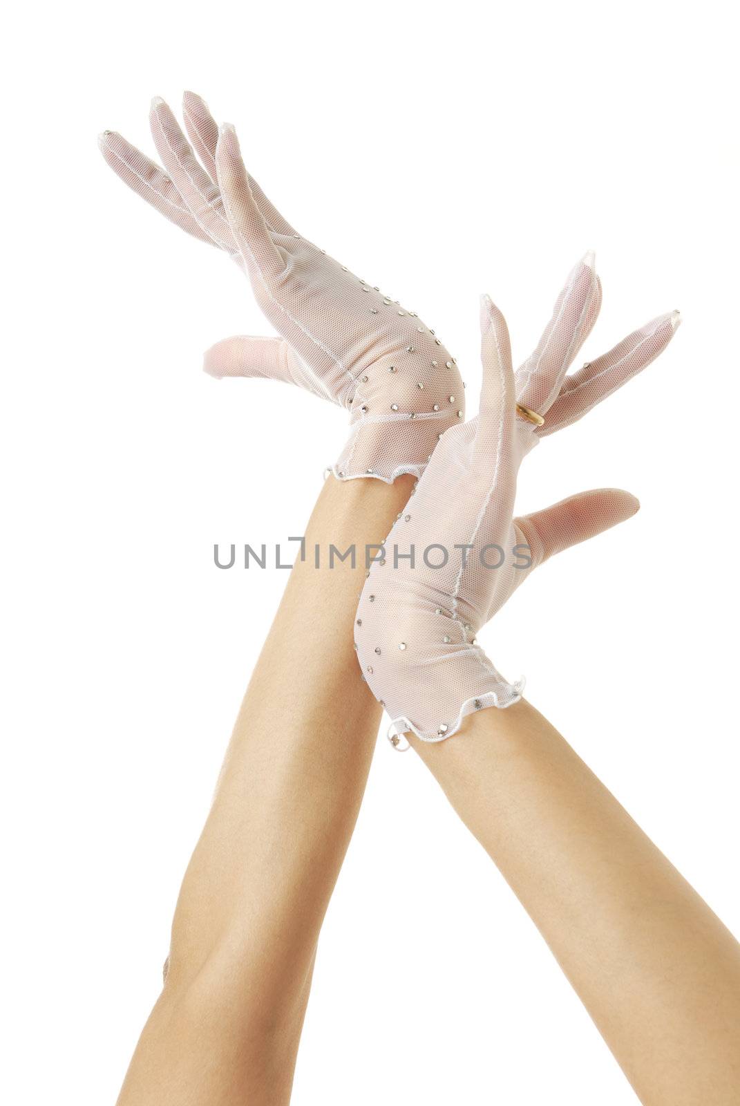 Close-up photo of elegant bride hands in gloves with wedding ring