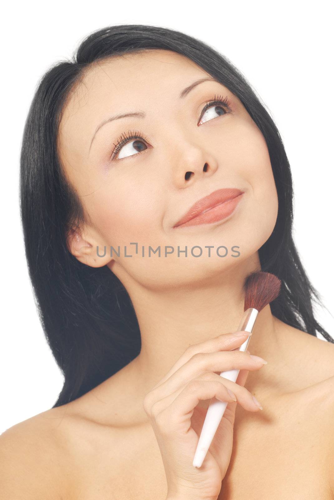 Smiling woman with powder brush on the white background