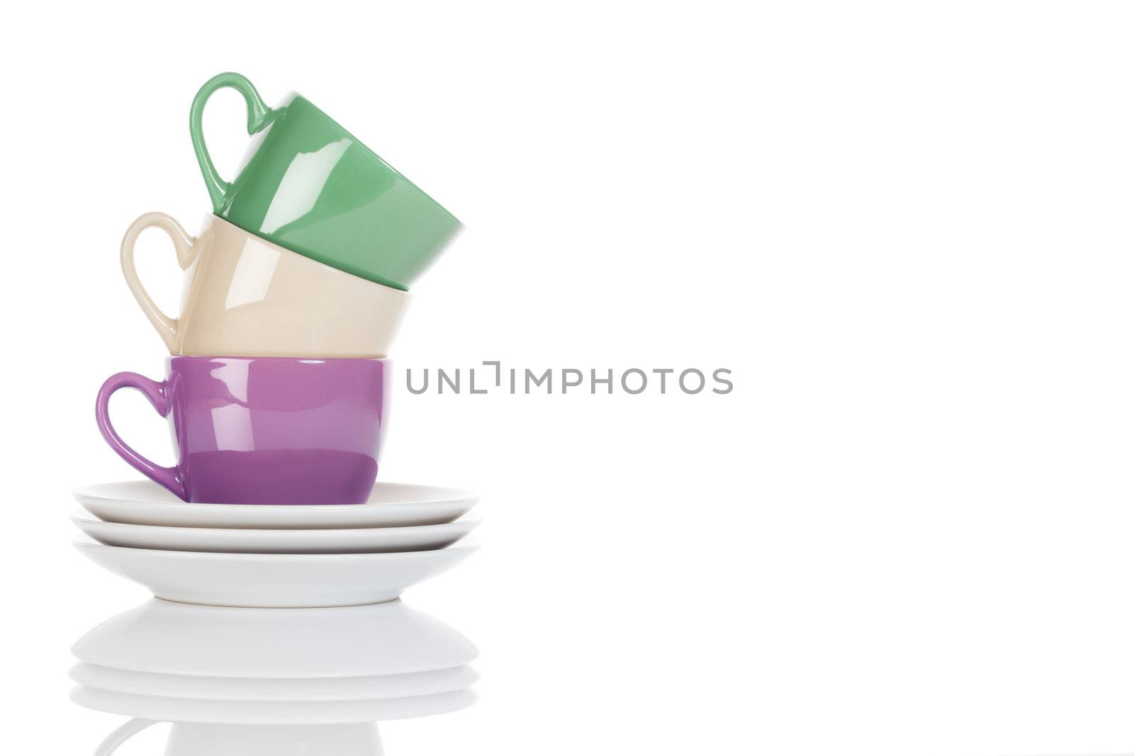 stapled purple, green and beige coffee cups on white background