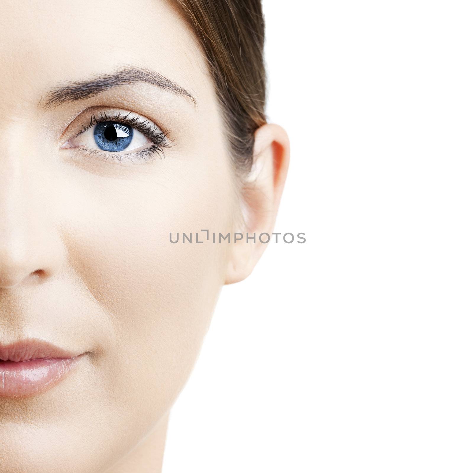 Close-up portrait of a beautiful young woman isolated on white background