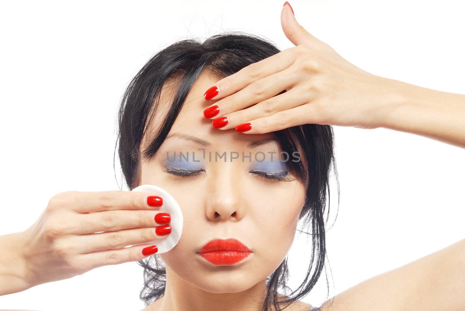 Beauty photo of the pretty woman applying make-up sponge 