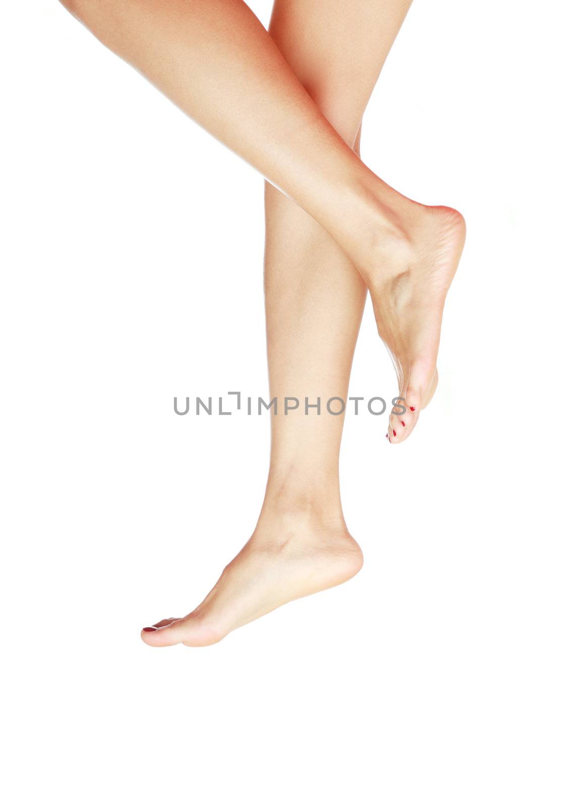 Woman legs without footwear on a white background