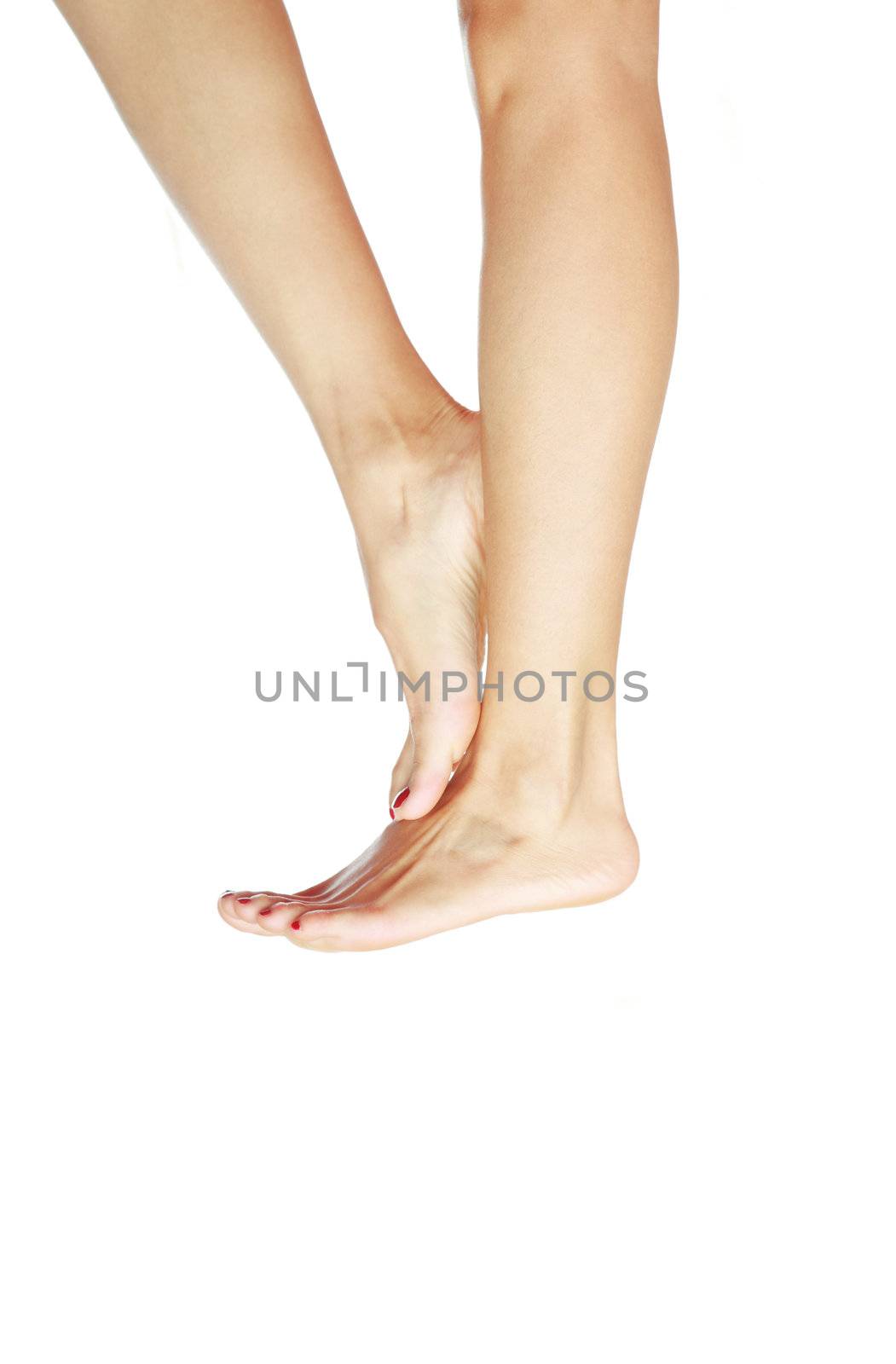 Female shoeless feet on a white background