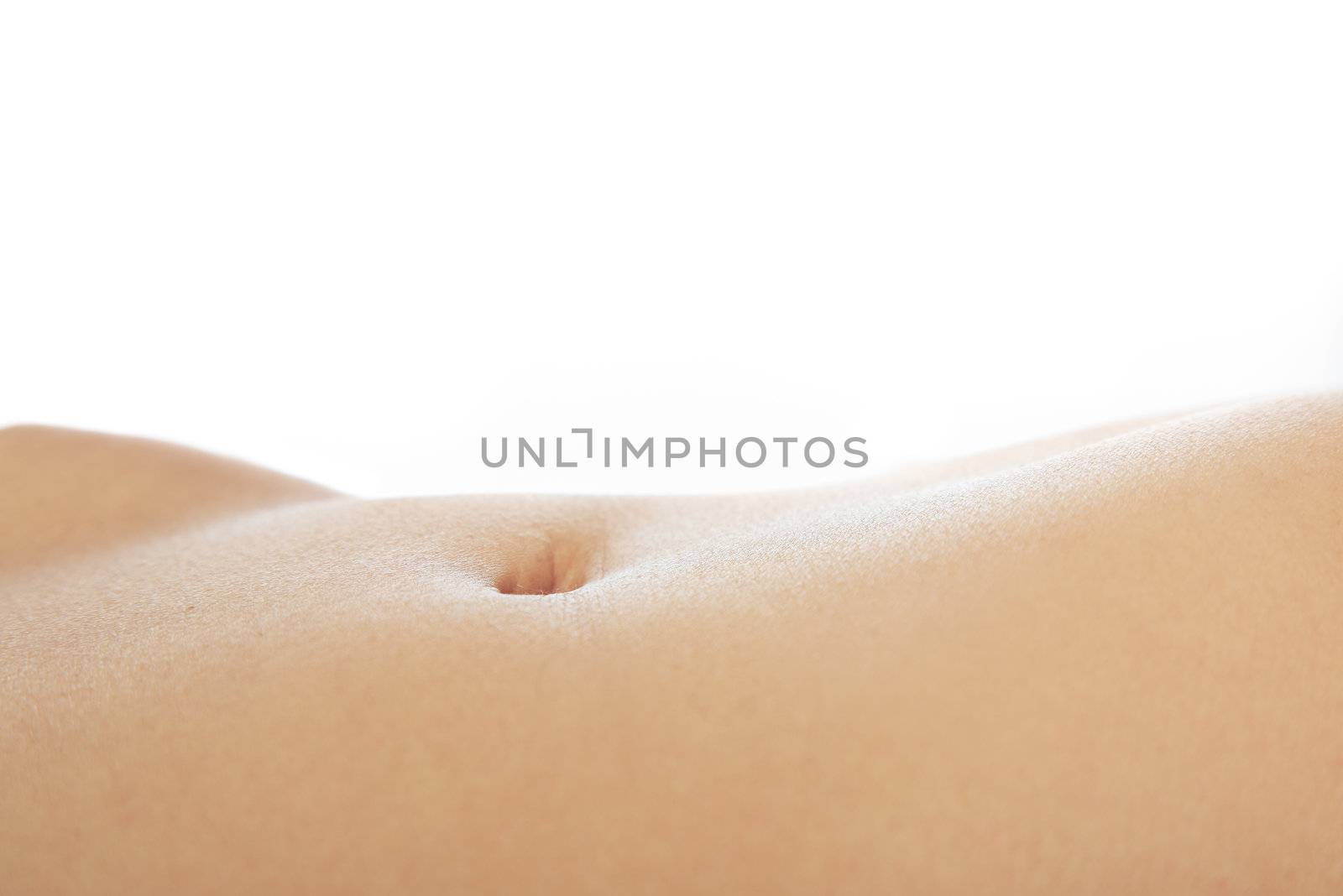 Female belly with soft skin on a white background