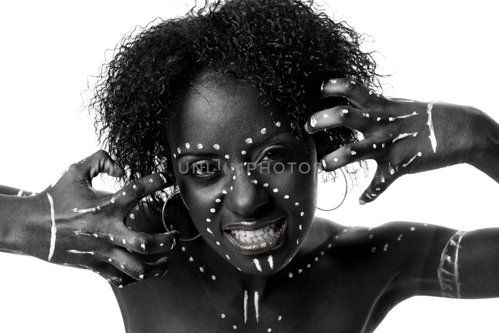 Beautiful African indigenous tribal fashion female face with white dots and stripes and aggressive expression, isolated.