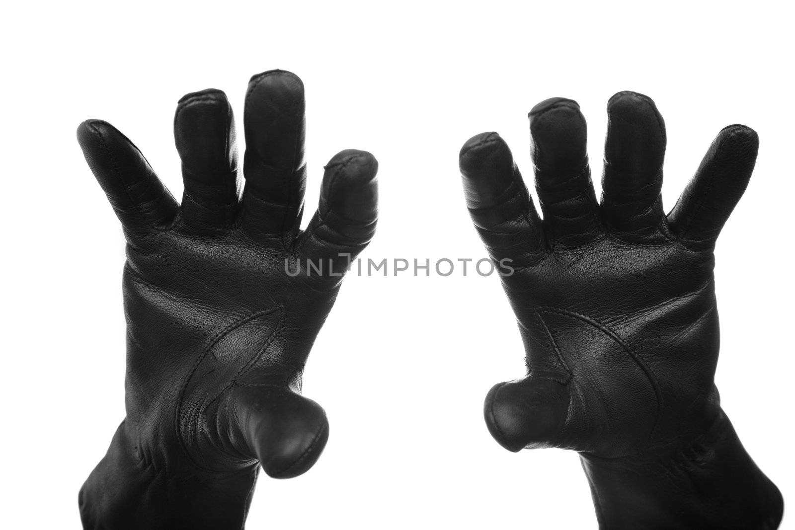 Hands of the criminal person in black leather gloves