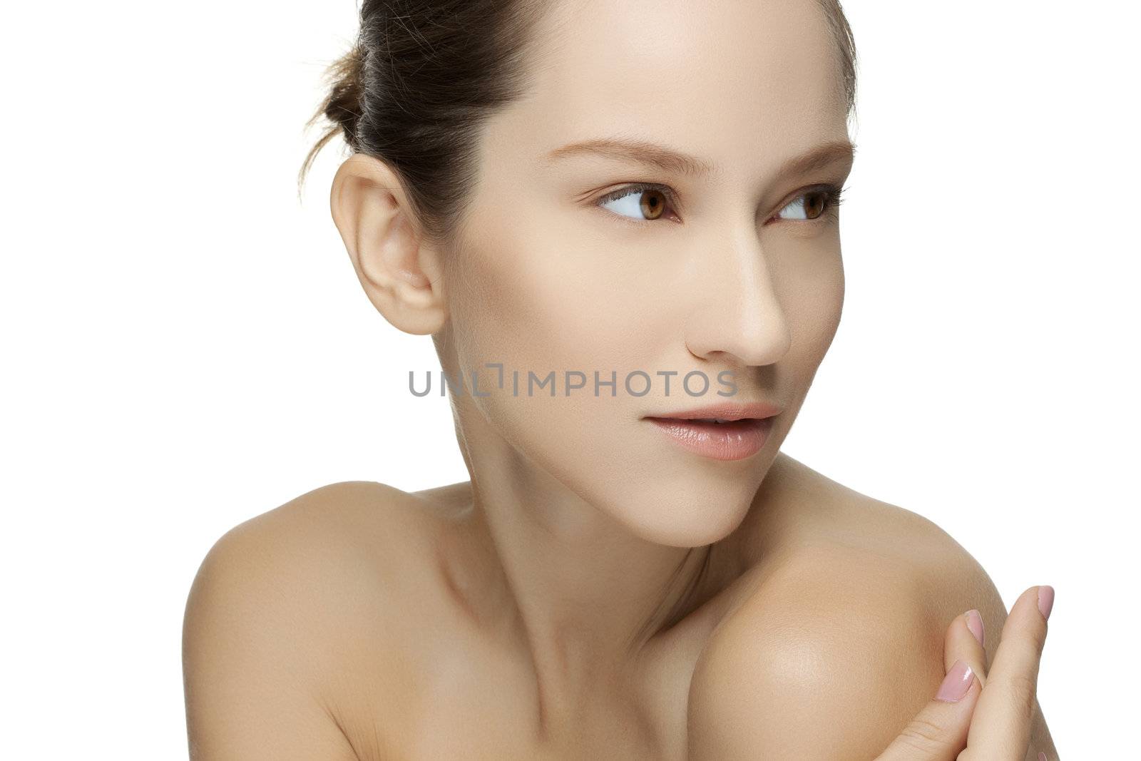 Beautiful young woman with clean skin of the face. Pretty female posing on white background