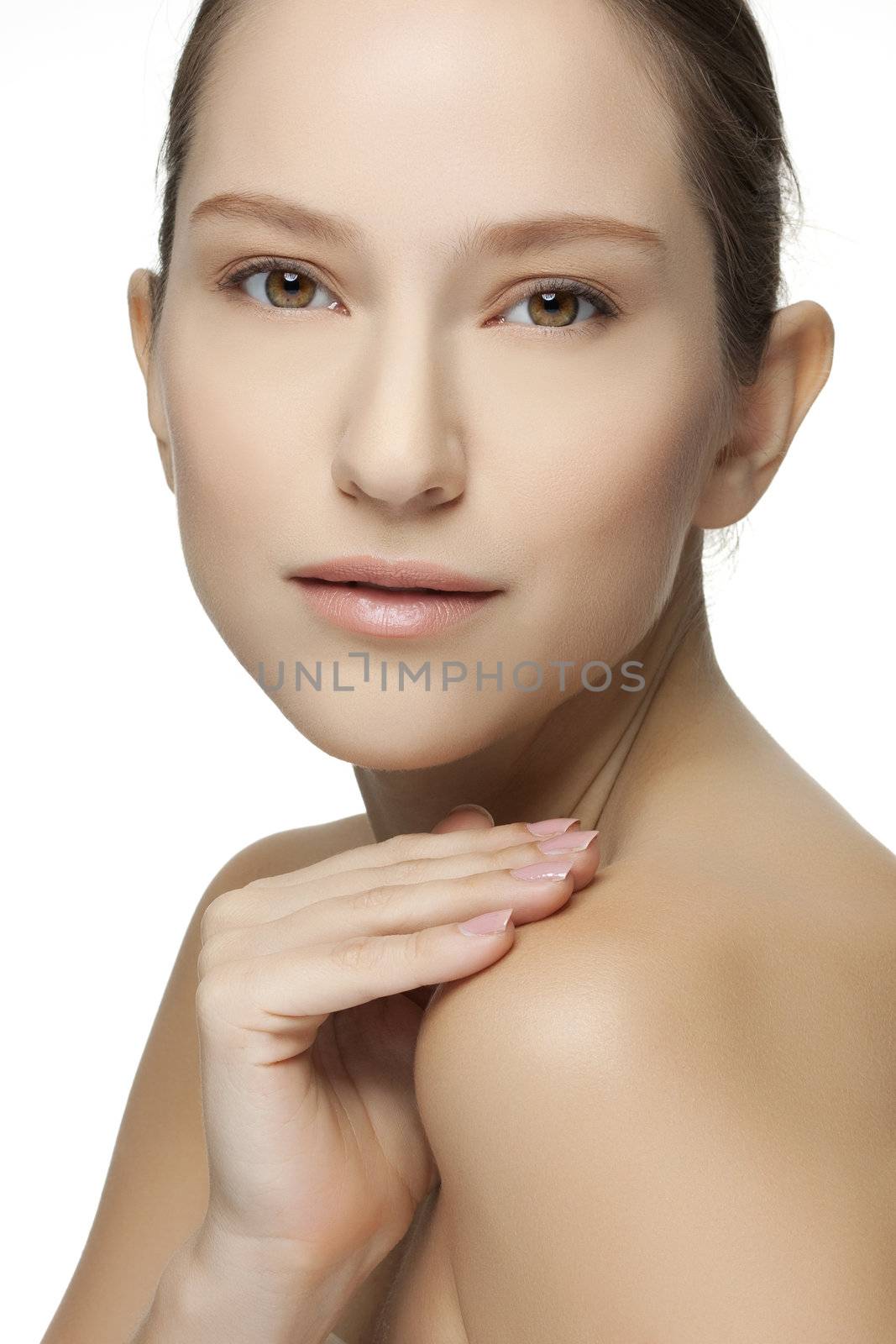 Beautiful young woman with clean skin of the face. Pretty female posing on white background