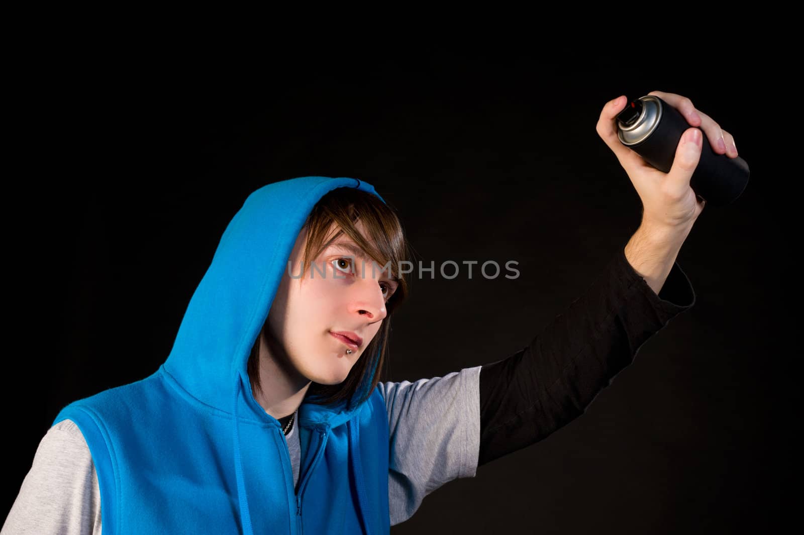 Teenager about to use a can of spray