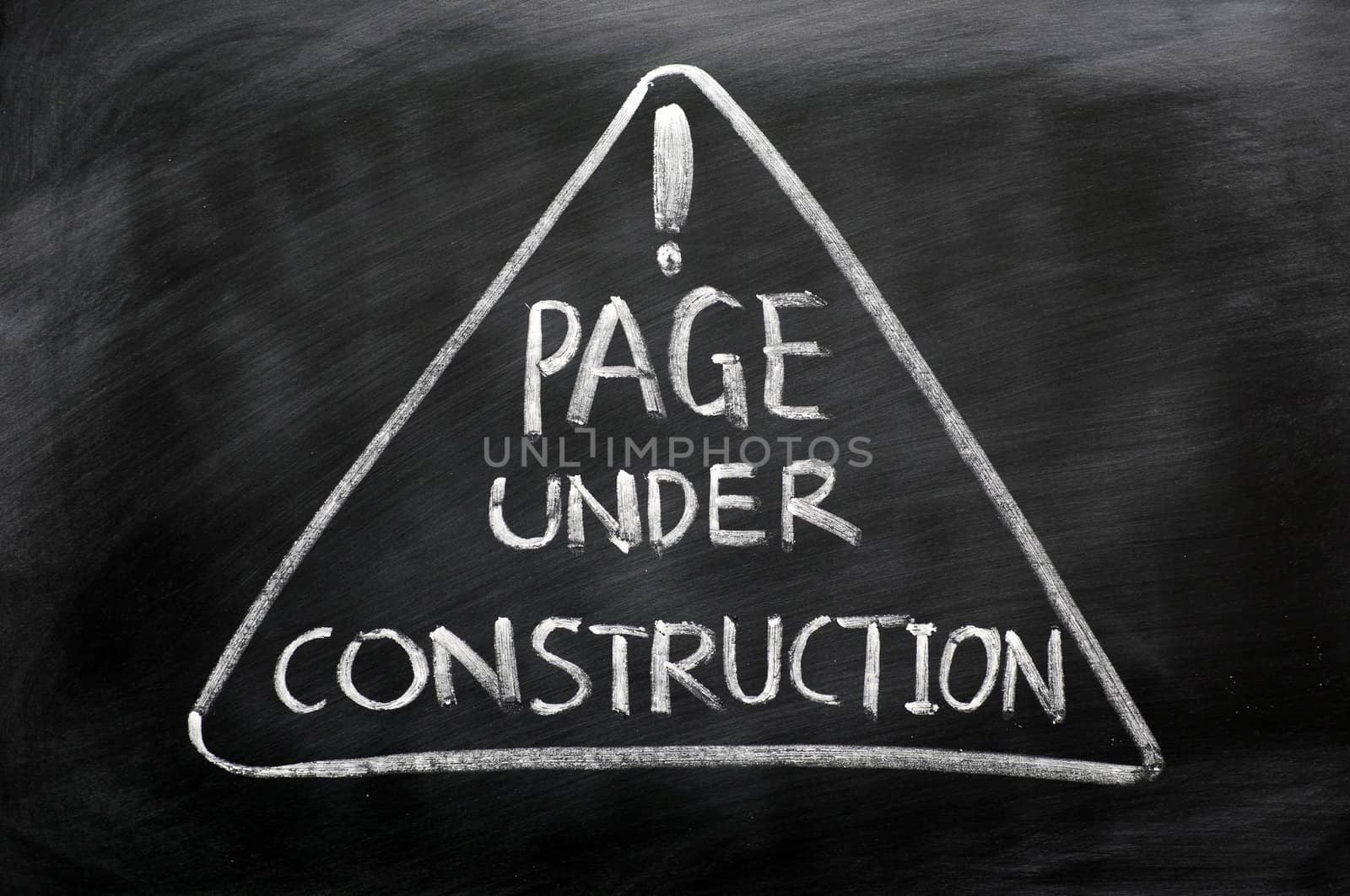 Page under construction concept drawn in chalk on a blackboard