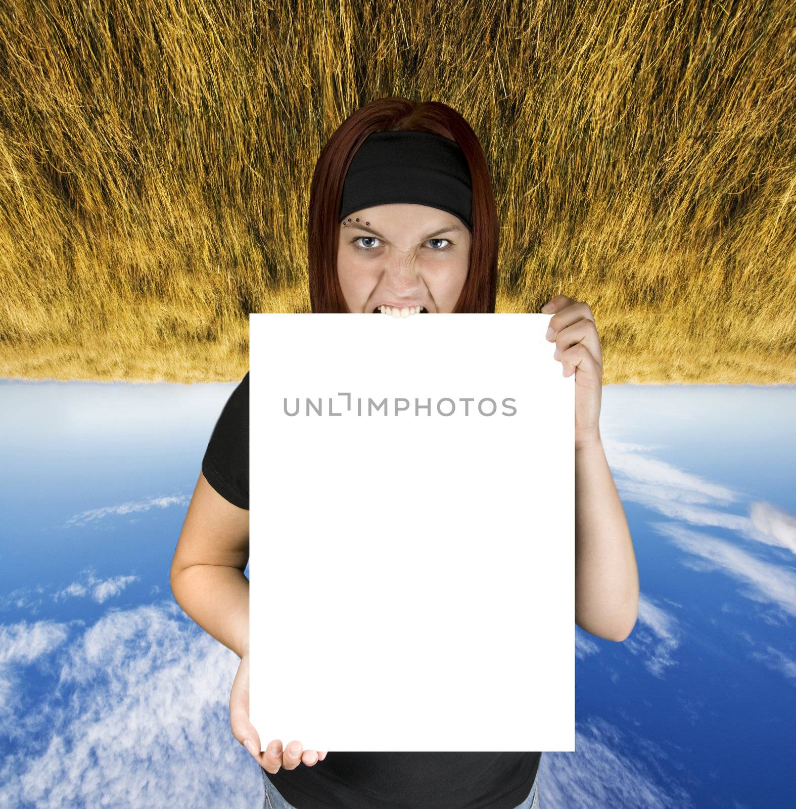 Redhead girl holding a white canvas perfect for design incorporation.

Shot in studio. Composite background.
