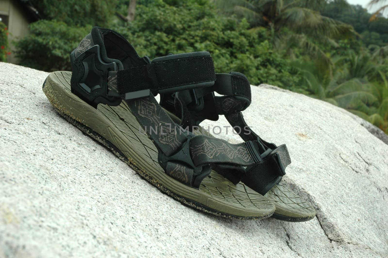 A pair of sandals on the rock