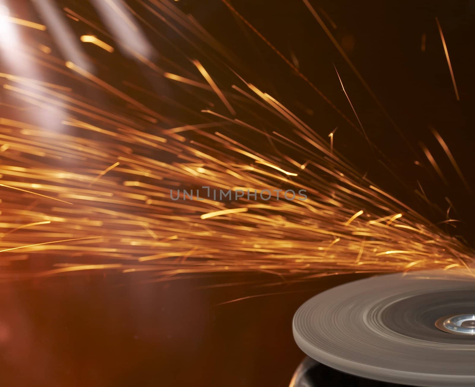 a close up picture of sparks on a grinding wheel