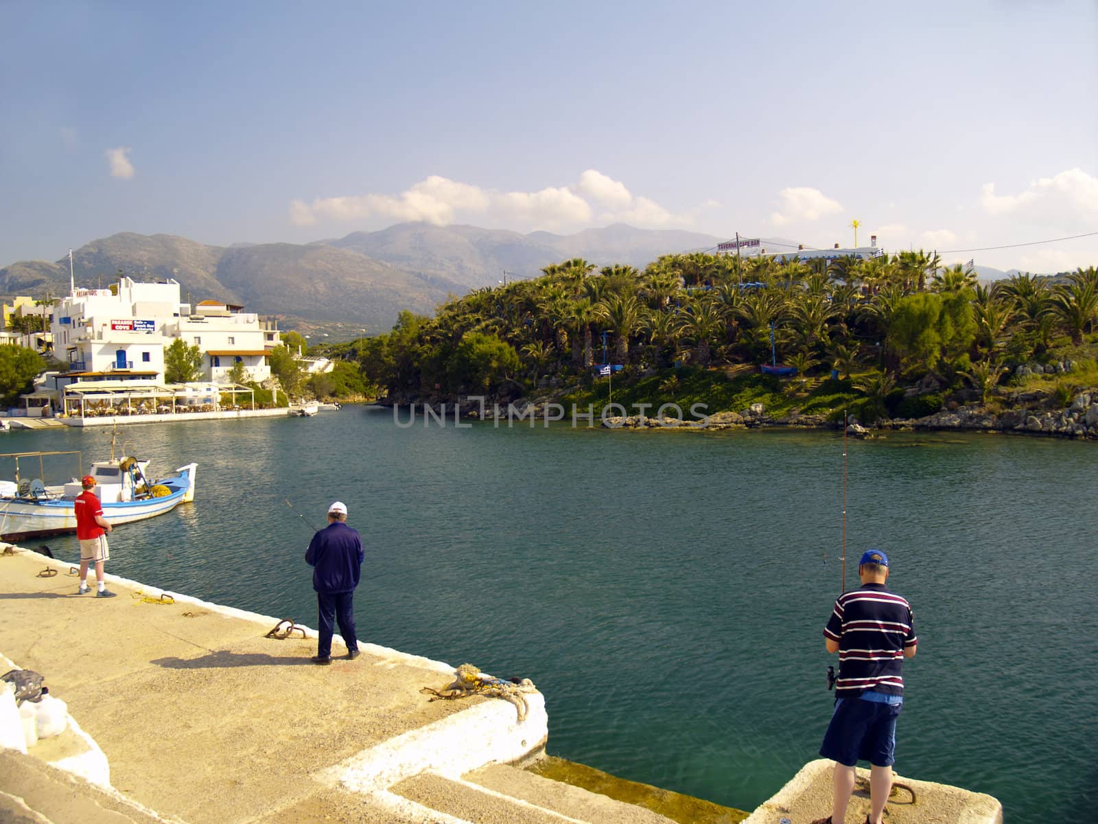 anglers at the harbour of sissi, crete