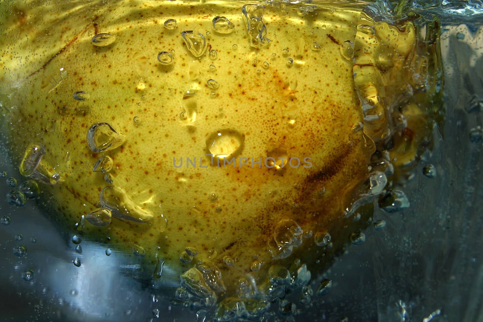 The image of a pear in water