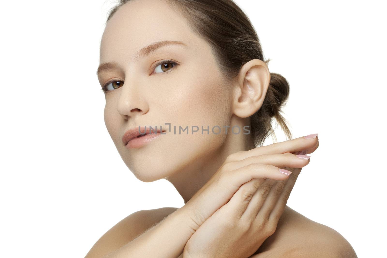 Beautiful young woman with clean skin of the face. Pretty female posing on white backgroun