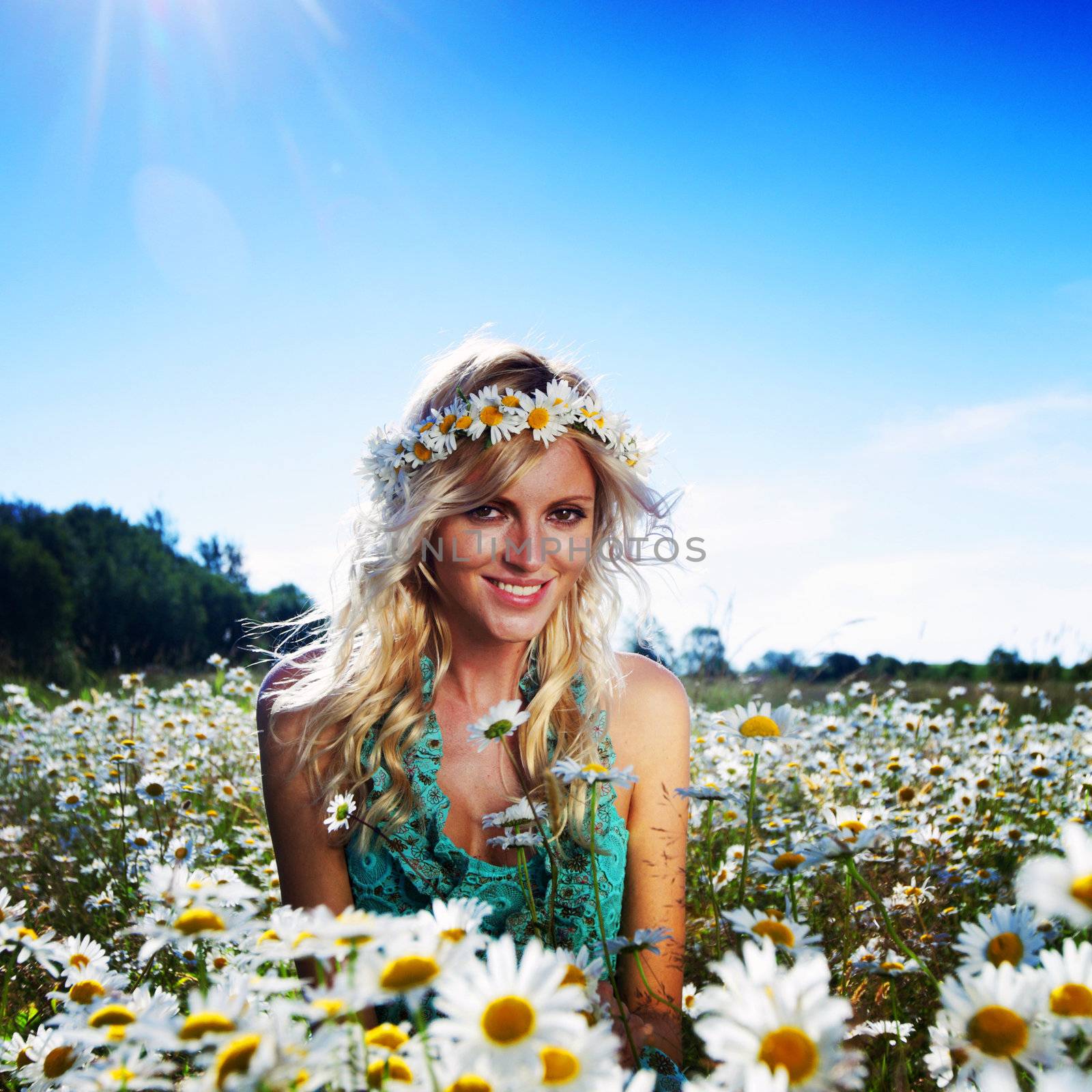  beautiful girl  in dress on the sunny daisy flowers field 