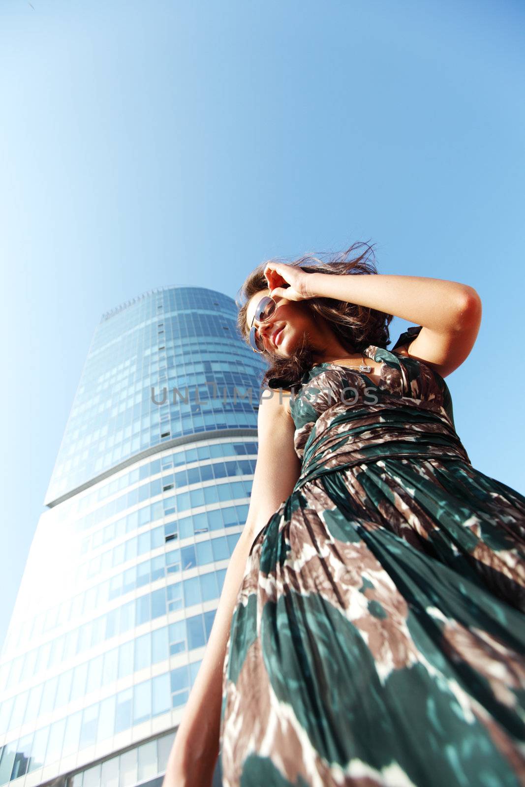  glamorous girl in the background of a skyscraper