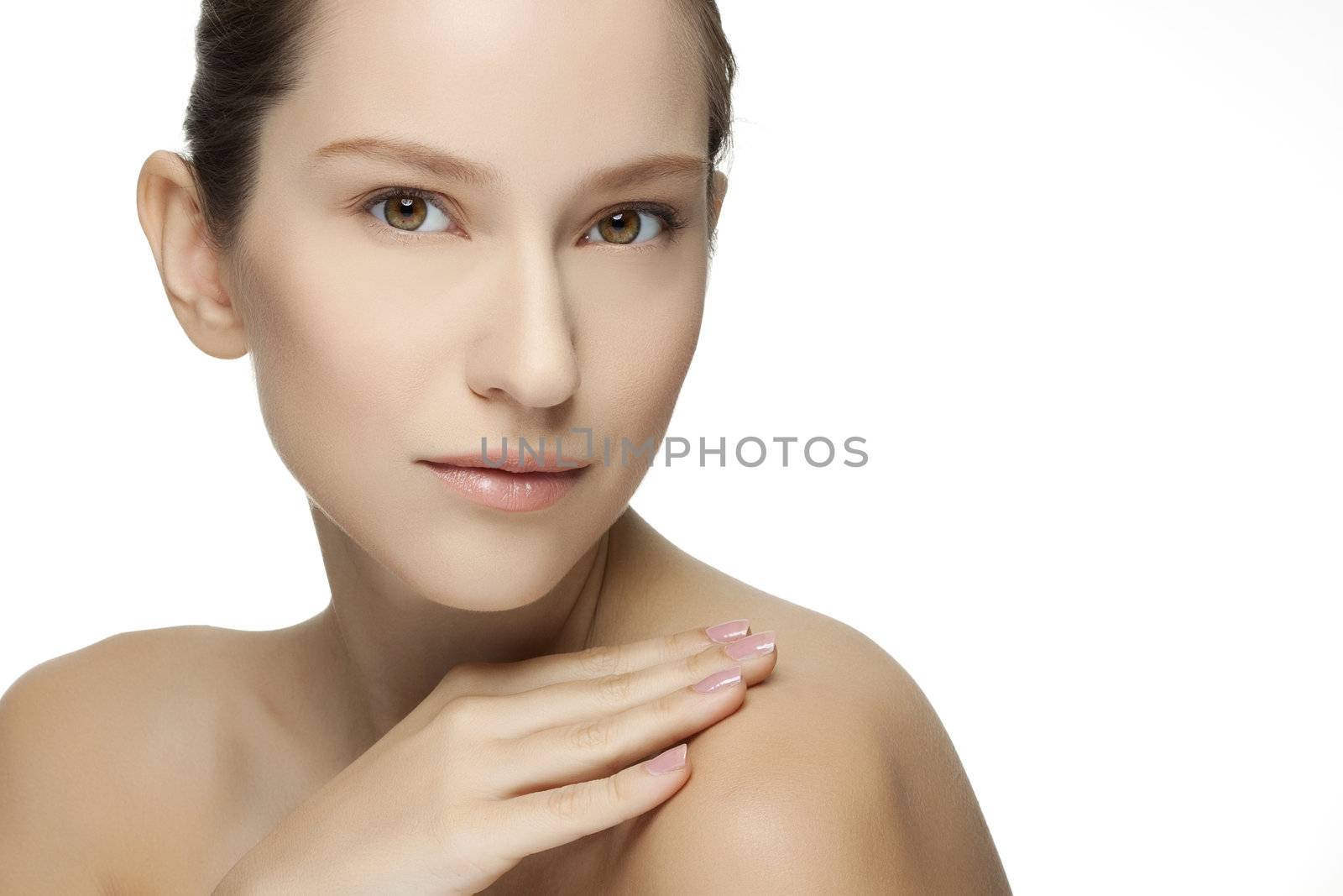 Beautiful young woman with clean skin of the face. Pretty female posing on white background