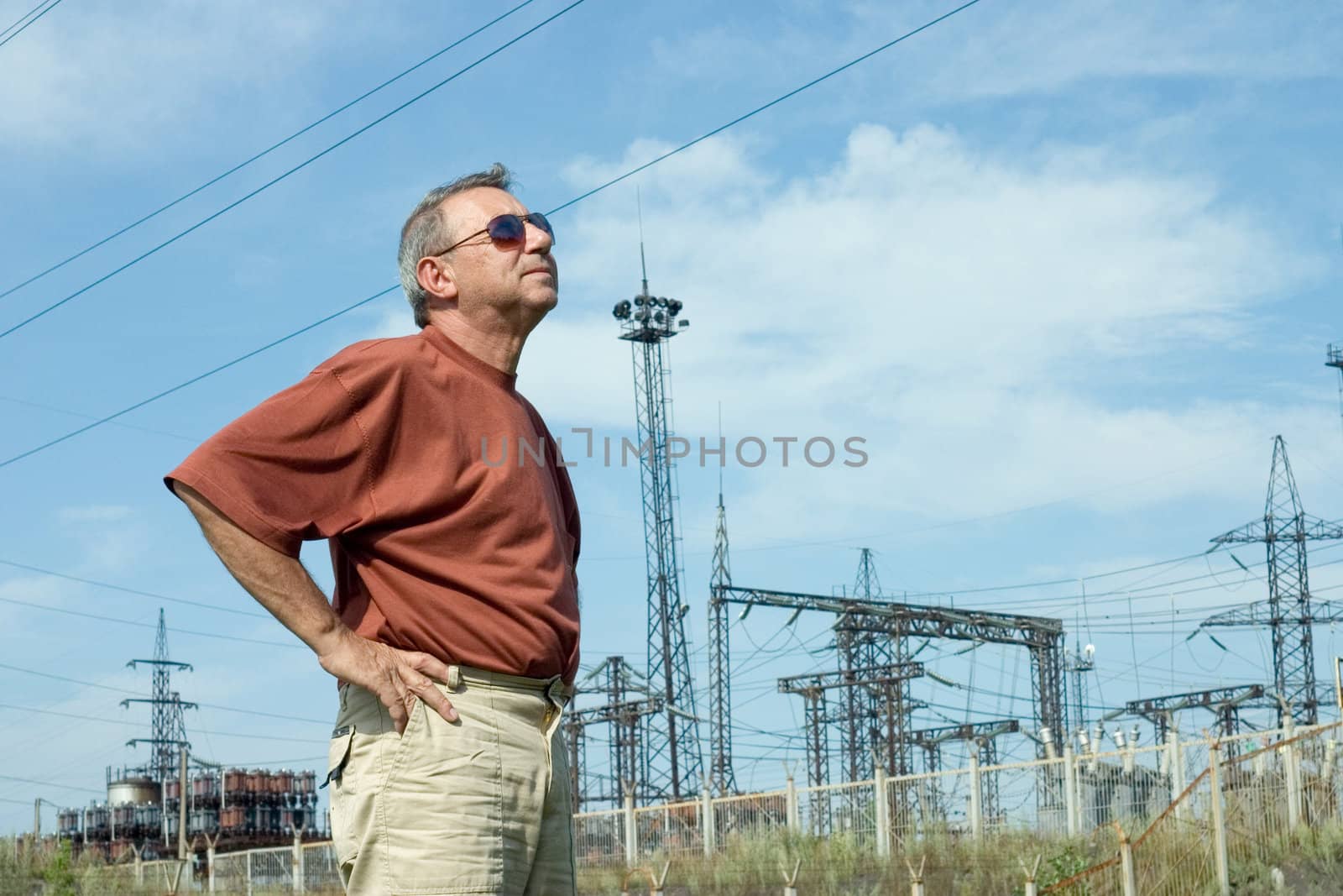 The man on a background of electric substation