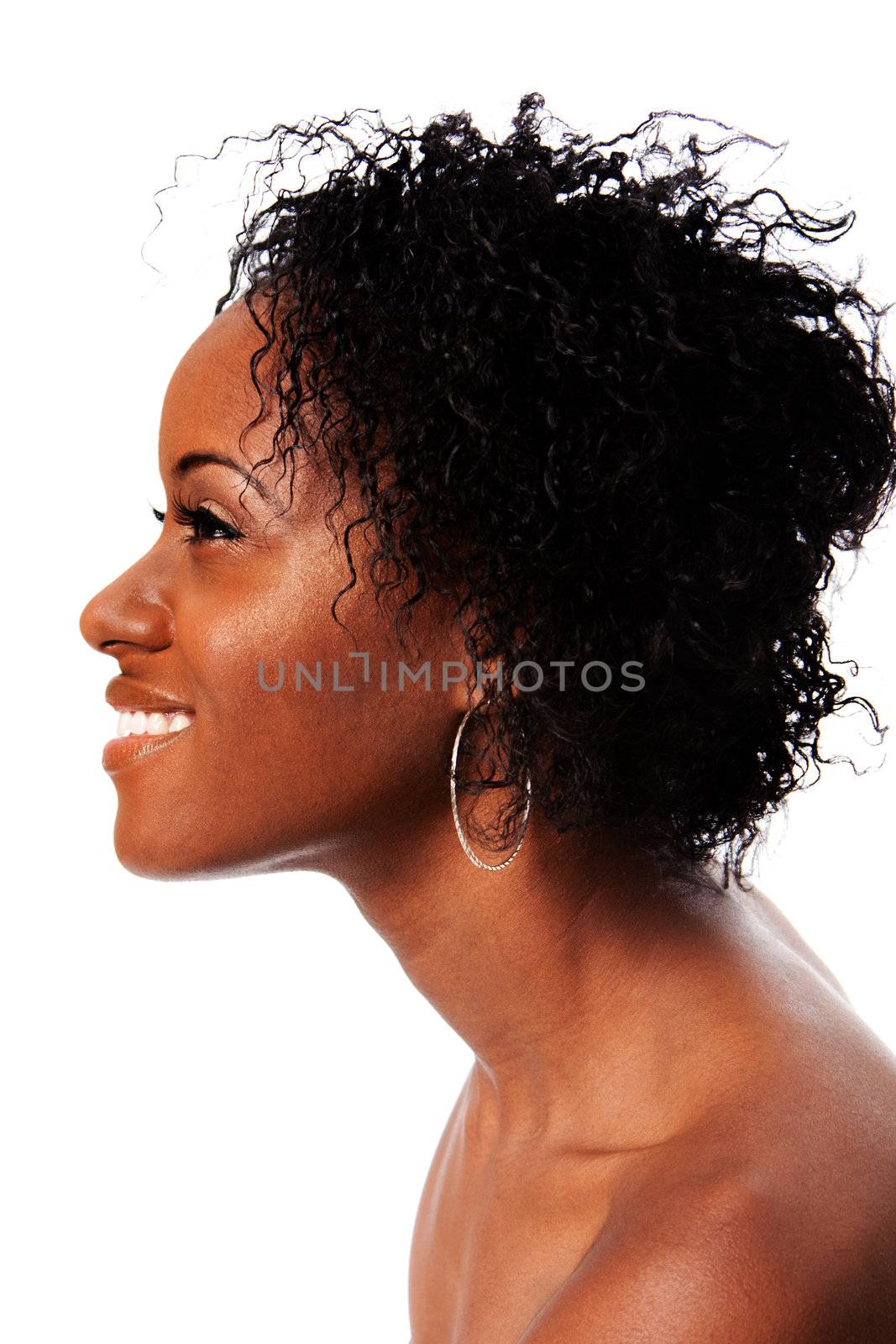 Side profile of a beautiful African woman face with Afro curly hair smiling showing white teeth, isolated.