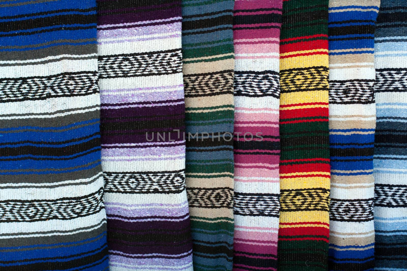 Colorful Indian rug display by GunterNezhoda