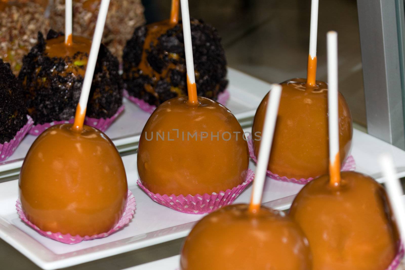 Candy apples on sticks in store display