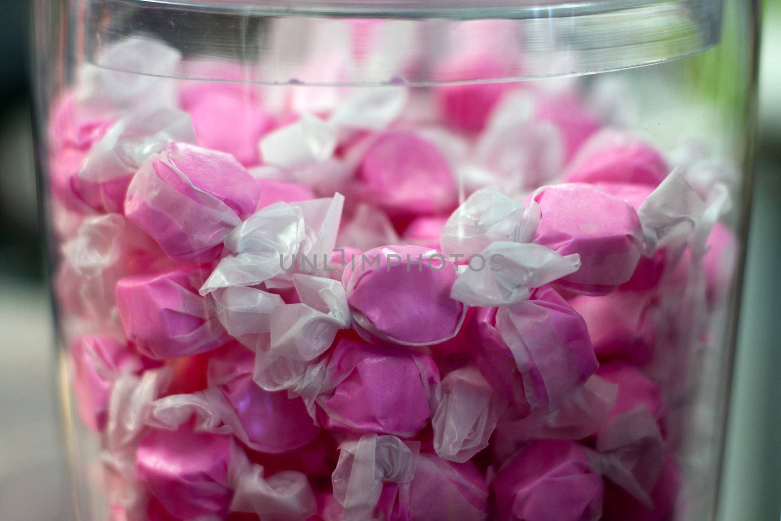 Pink wrapped Saltwater candy in glass container
