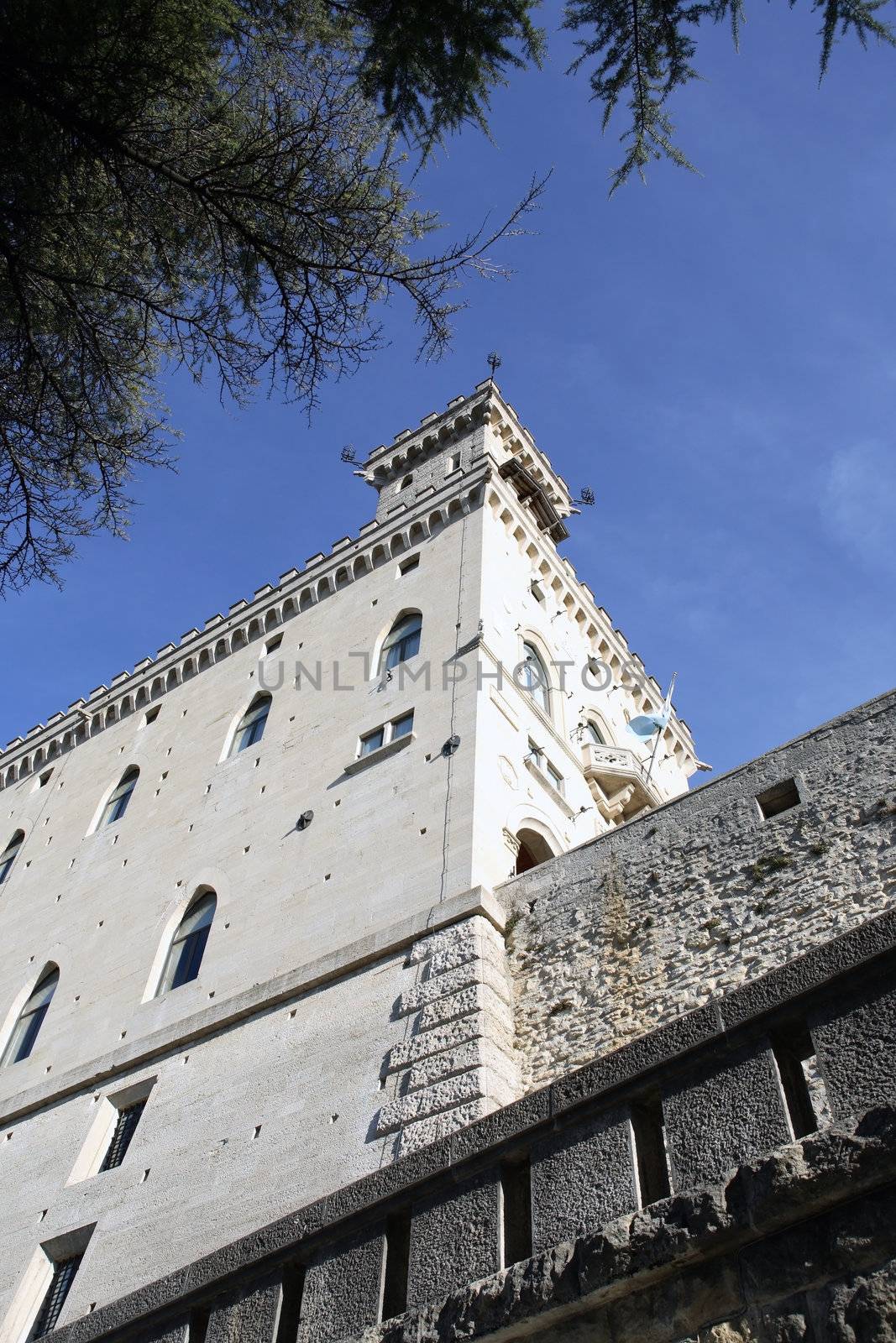 Closeup of ancient fortress wall and tower against blue sky